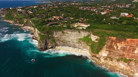 Aerial View of Coastal Cliffs and Village in Uluwatu Bali Stock Footage 340659001