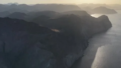 Aerial view of coastal cliffs and mountains in San Evaristo near La Paz, Baja Vídeos de archivo 346155104