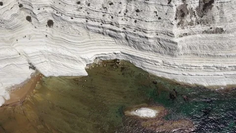 Aerial view of coastal cliffs with white rock formations, sandy beach Stock Footage 345149542