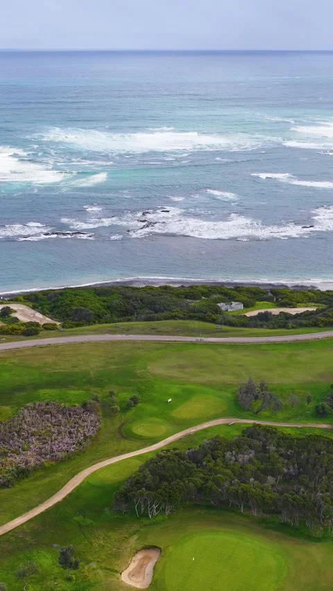 Aerial View of Coastal Golf Course Beside the Ocean in Flinders Victoria Stock Footage 345477330