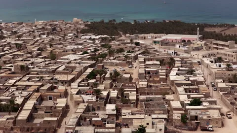 Aerial view of a coastal middle eastern town by the sea, socotra island Stockbeeldmateriaal 334606912
