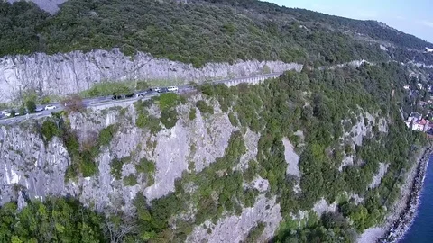 Aerial view of Coastal road. Drone flying along coast near Trieste Italy Stock Footage 80908301