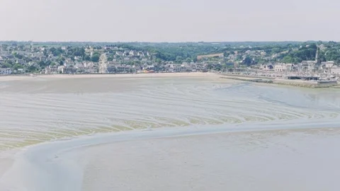 Aerial view of the coastal town of Binic in Brittany, France, with its sandy Stock Footage 346665901