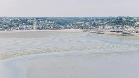 Aerial view of the coastal town of Binic in Brittany, France, with its sandy Stock Footage 346722990