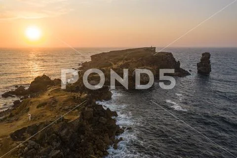 Aerial view of the coastline and cliffs during sunset near the city of Peniche Stock Photos