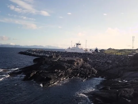 Aerial View of Coastline with Ferry pulling into Marina in Denmark Waves Rocks 스톡 동영상 82980930