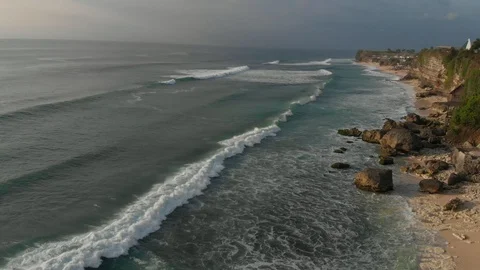 Aerial view of coastline with ocean waves. Beach and waves for surfing in Bali Stock Footage 112287824