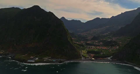Aerial view of the coastline with the ocean waves in Sao Vicente municipality at Video stock 267088877