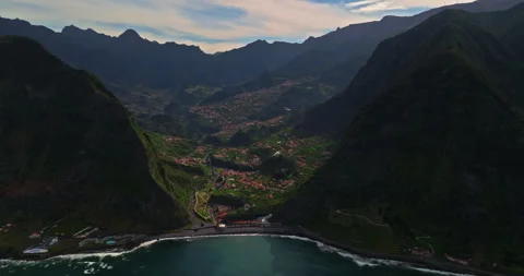 Aerial view of the coastline with the ocean waves in Sao Vicente municipality at Stockbeeldmateriaal 270737575
