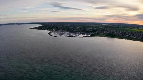 Aerial view of coastline at sunset Stock Footage 321445025
