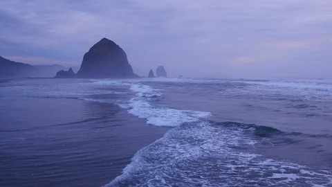 Aerial view of coastline toward Haystack Rock at sunrise on the Oregon Coast 動画素材 108409463