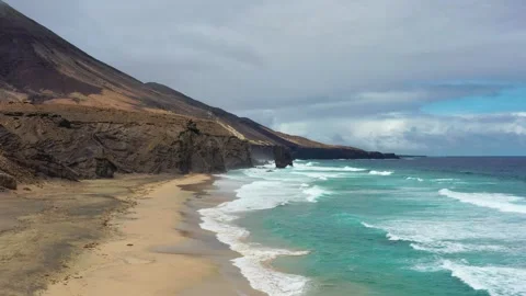 Aerial view of Cofete Beach with Roque del Moro on a cloudy day, Fuerteventur Stock Footage 320727983