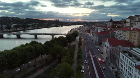 Aerial View of Coimbra's Riverfront at Dusk Along the Mondego River Stock-Footage 345840211