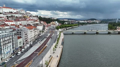 Aerial View of Coimbra's Riverfront at Dusk Along the Mondego River Stock-Footage 345840261