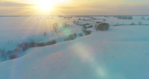 Aerial view of cold arctic field landscape, trees with frost snow, ice river and Stock Footage 291921165