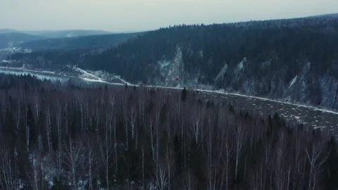 Aerial view of the cold river, rocks and forest in early winter 動画素材 146743853