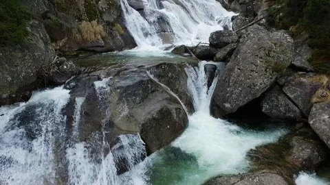 Aerial view of a cold small waterfall in High Tatras Mountains Stock Footage 126098690