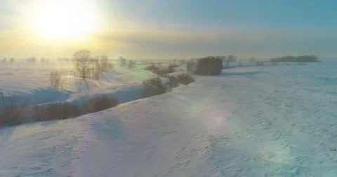Aerial view of cold winter landscape arctic field, trees covered with frost snow Stock Footage 165573724
