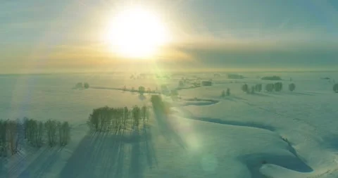Aerial view of cold winter landscape arctic field, trees covered with frost snow Stock Footage 311525101