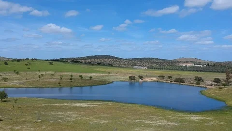 Aerial view of colorful agricultural field with a lagoon Stock Footage 88409377