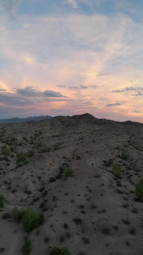 Aerial View of a Colorful Cloudy Sunset over the Mojave Desert in Arizona Stock Footage 264012315