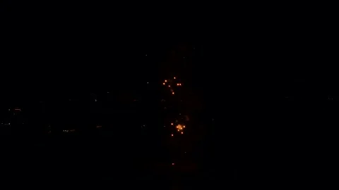 Aerial view of colorful fireworks exploding over the Portimao city, Portugal Video stock 323874479