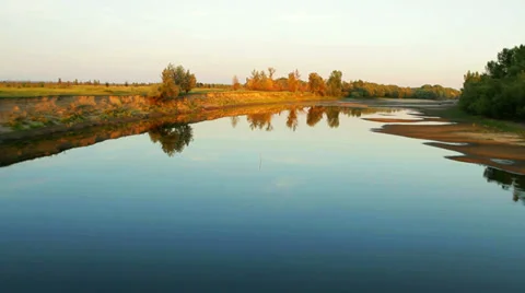 Aerial View: Colorful sunset. Flying over the river. Golden autumn. Stock Footage 33657207