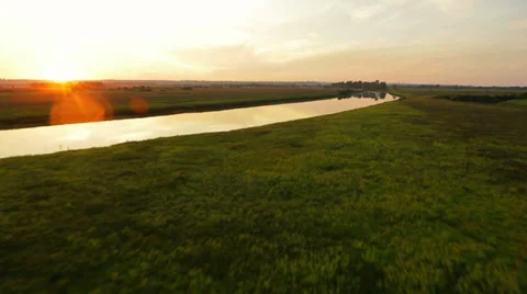 Aerial View: Colorful sunset. Flying over the river. Golden autumn. Stock Footage 33657889