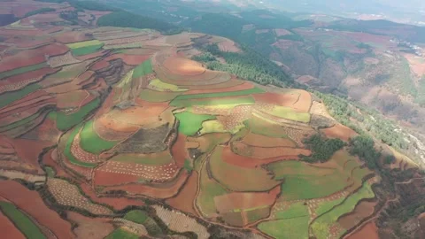 Aerial view of colorful terraced fields and red soil in Dongchuan, Yunnan, China Vídeos de archivo 345045793