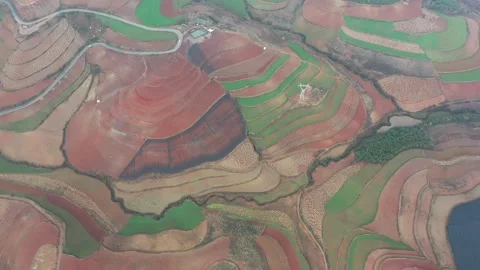 Aerial view of colorful terraced fields and red soil in Dongchuan, Yunnan, China Vídeos de archivo 345046683