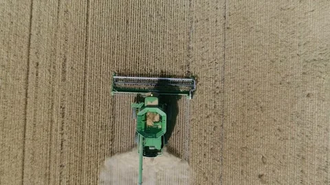 Aerial view of combine during Fall harvest near Regina, Saskatchewan. Видео 153440577