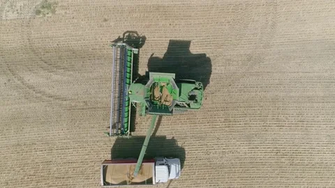 Aerial view of combine during Fall harvest near Regina, Saskatchewan. Видео 153440582