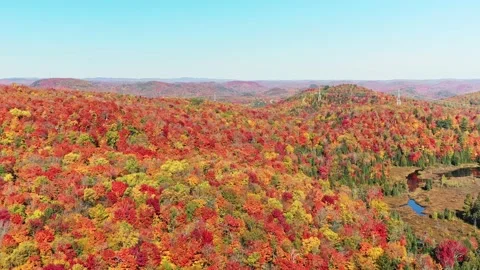 Aerial view coming down showing the mountains and revealing hydro lines Stock-Footage 164009560