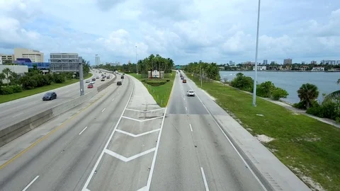 Aerial view coming in to Miami Beach and passing Welcome to Miami Beach sign Stock Footage 96232607