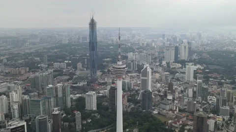 Aerial view of communications tower and the second tallest building in the World Stock Footage 150290025