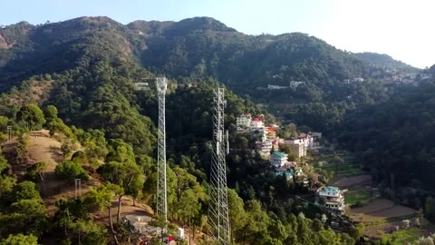 An aerial view of communications tower orbits around Stock Footage 149875041