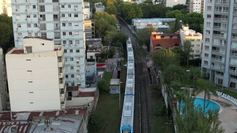 Aerial View of Commuter Train Passing Through Residential Neighborhood Stock-Footage 331897361
