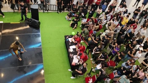 Aerial View of Competition Event with Crowd and Contestant on Stage Stock Footage 311853013