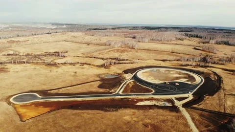 Aerial view of completion of road construction of testing ground for cars. Black Stock Footage 167154083