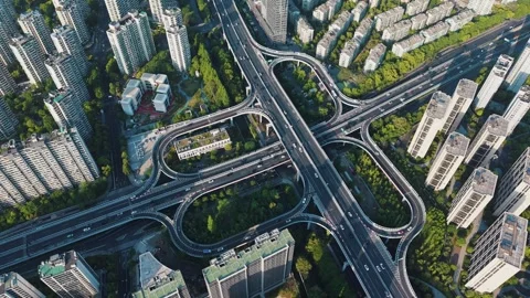 Aerial view of a complex highway interchange surrounded by tall buildings and Video stock 308513983