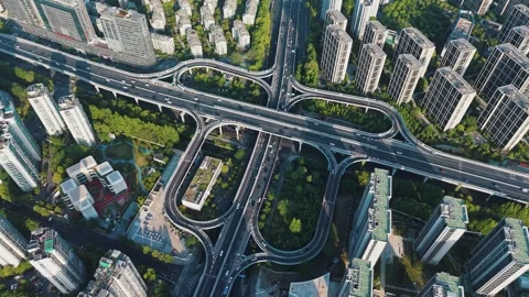 Aerial view of a complex highway interchange surrounded by tall buildings and Video stock 313325122
