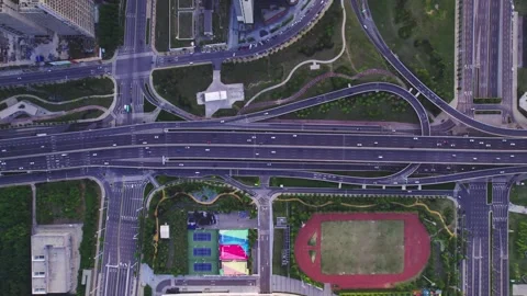 Aerial View of Complex Highway Interchange with Sports Fields Stock Footage 337421000