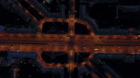Aerial view of a complex intersection with cars lanterns and headlights Stock Footage 113194348