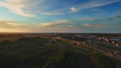 Aerial view of complex motorway junction in suburban-rural transition Video stock 340039544