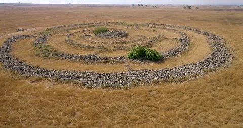 Aerial view of concentric stone circles. Rujum Al-Hiri, Golan Heights, Israel. Stock Footage 247196855