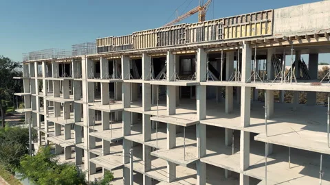 Aerial view Concrete frame of multi storey building under construction with Stock Footage 318031387