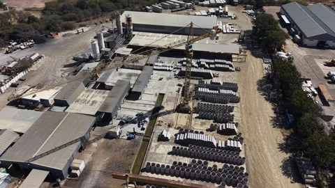 Aerial View of Concrete Pipe Storage Yard With Industrial Crane Video stock 342605443