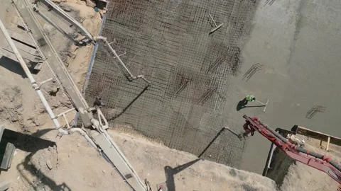 Aerial view of concrete pouring at construction site Stockbeeldmateriaal 334030366