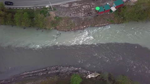 Aerial View of the Confluence of Two Rivers in a Mountain Valley Stock Footage 129251677