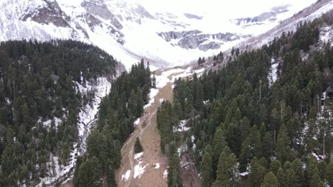 Aerial view of coniferous forest and snow-capped Sofia waterfalls Stock Footage 337710669